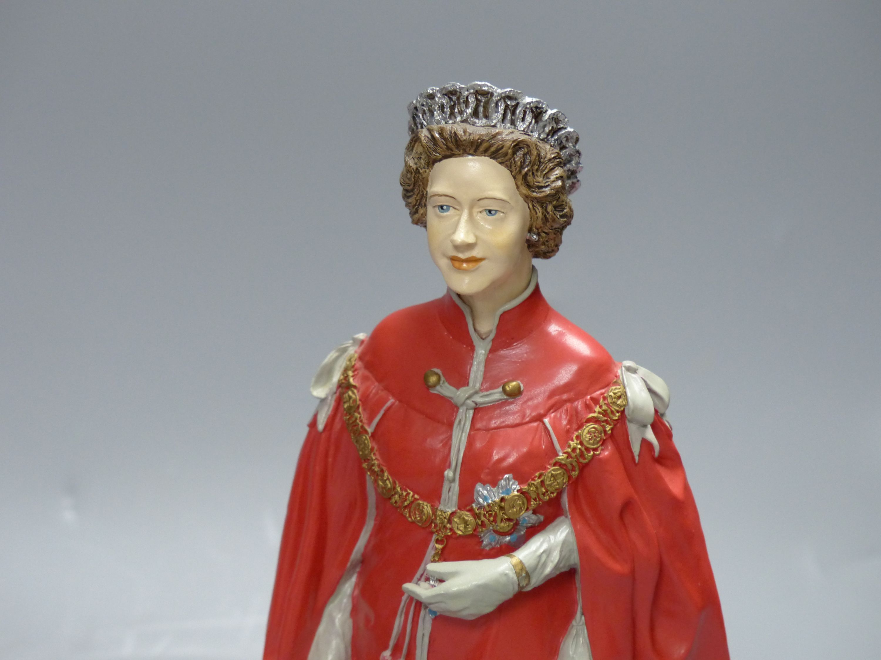 Two cold-cast porcelain figures of HM Queen Elizabeth II by Timothy Potts, H 22cm